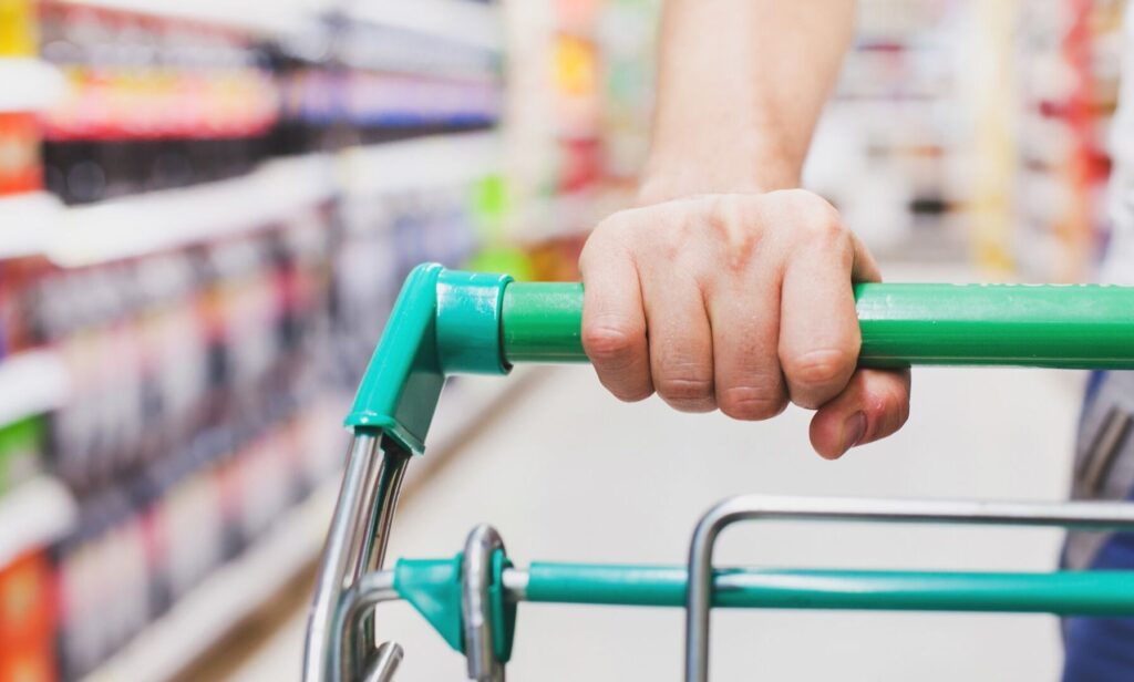 someone pushing a supermarket trolley